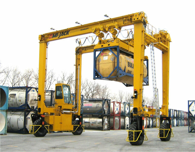 Large Cylinders Handled By A Travelift With Power Rotating Spreader Bar